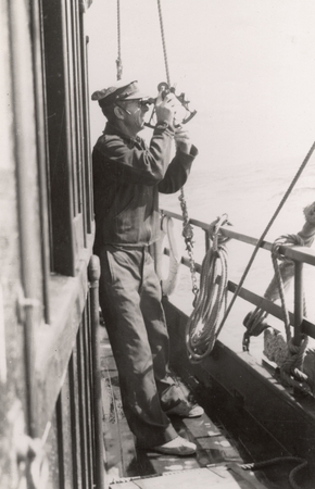 Clem Stose shooting the sun with a sextant aboard R/V E.W. Scripps. Gulf of California Expedition, 1939
