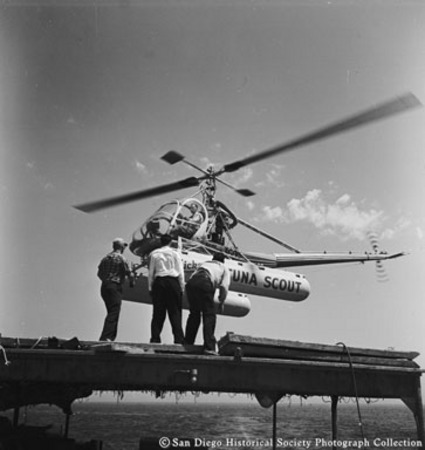 Tuna Scout helicopter landing on stern canopy of Chicken of the Sea