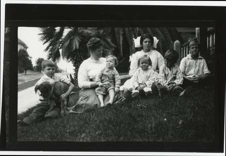 Mary Catherine and six Fletcher children on grass