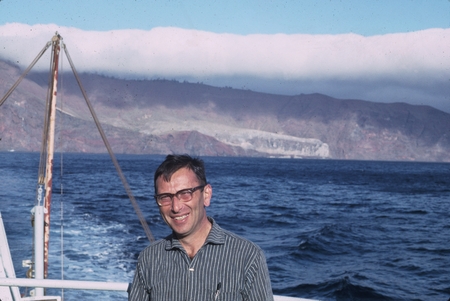 Heinz A. Lowenstam with eastern shore of Guadalupe Island in distance