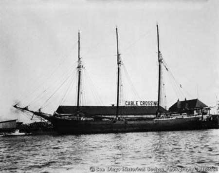 Docked three-masted sailing ship