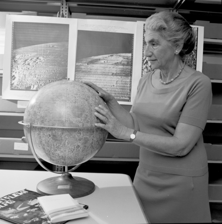 Gertrude Weiss Szilard with lunar maps and moon globe, UC San Diego