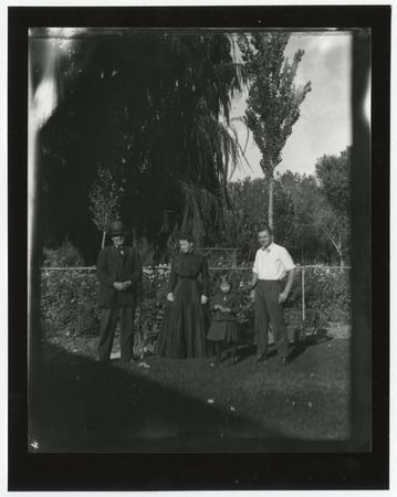Portrait of unidentified people, posing outdoors