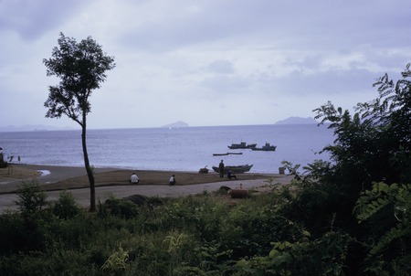 Men working by the shore