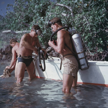 Scuba divers with equipment