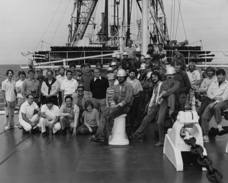 Entire crew of Leg 81 on the steel beach, located on the foredeck of the Deep Sea Drilling Project research ship D/V Gloma...