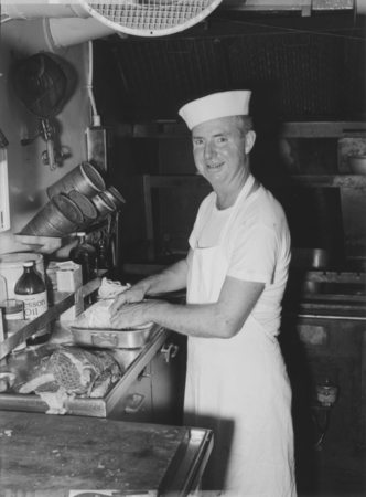 Thomas J. O&#39;Callaghan, the cook on board R/V Horizon, prepares a meal in the ship&#39;s galley