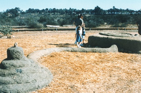 The Great Balboa Park Landfill Exposition of 1997: family examining an adobe sculpture