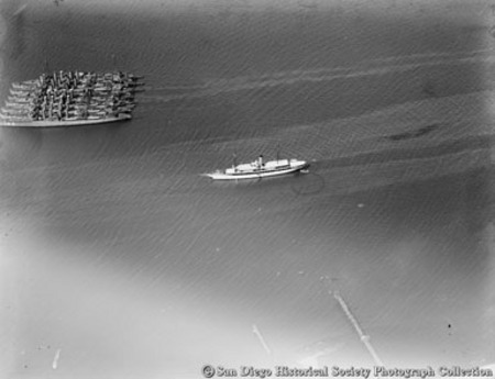 Aerial view of John D. Spreckels&#39;s yacht Venetia and U.S. Navy destroyers on San Diego Bay