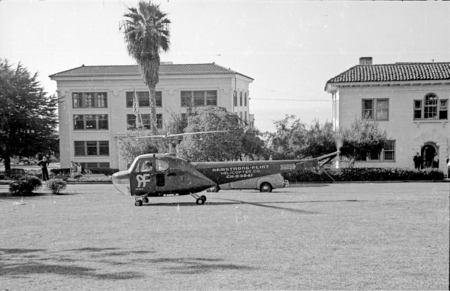 Helicopter on the lawn at Scripps Institution of Oceanography campus during filming for actor Errol Flynn&#39;s short film &quot;Cr...