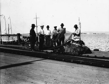 Fishermen inspecting nets on Embarcadero