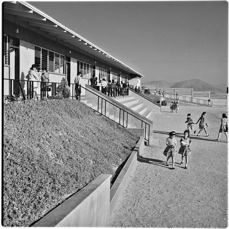 Children playing outside at Alessio School Number 4, Colonia Postal