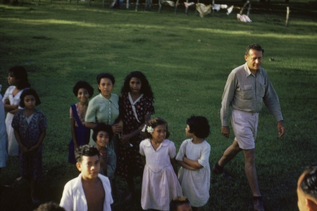Oceanographer Roger Revelle (right) during the Capricorn Expedition (1952-1953) shown here with some children in Tonga, th...