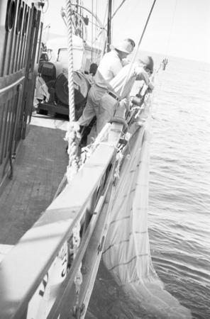 Crew members with plankton net aboard R/V E.W. Scripps