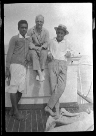 Lambert in center, Malakai Veisamasama on left, with European man