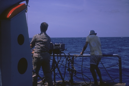 Russell Raitt (right) and George G. Shor slacking hydrophone cables. Onboard R/V Thomas Washington, Indopac Expedition. Se...