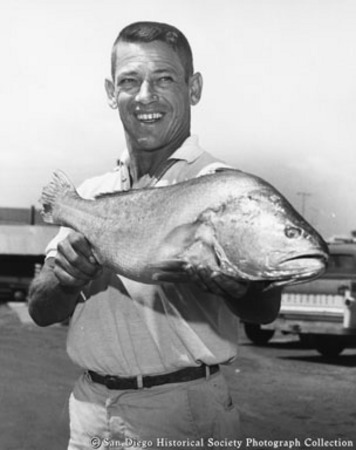Man holding catch of tuna