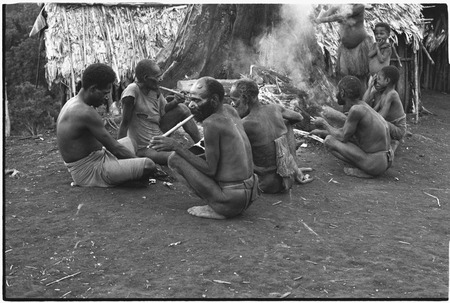 Yeria, Wanuma Census Division: men smoke around a fire