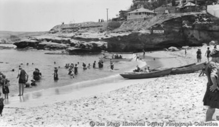 People on beach and wading in La Jolla Cove