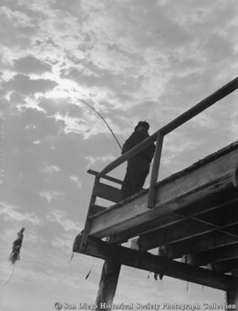 Man fishing from pier