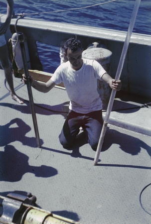 Jeffery Frautschy with cores in hand while on the deck of R/V Horizon during the MidPac expedition. The MidPac expedition ...