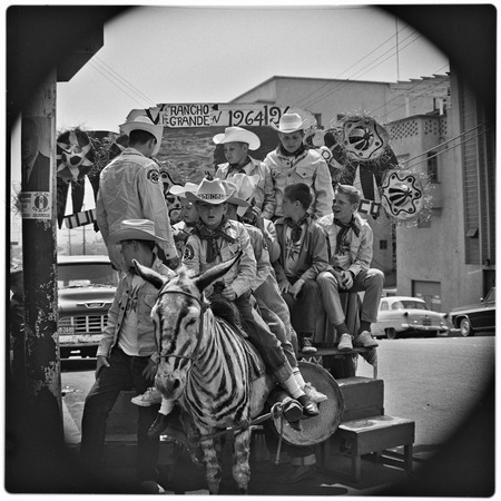 Members of the Royal Rangers Christian youth organization, posing for a photograph astride a typical Tijuana burro on Aven...