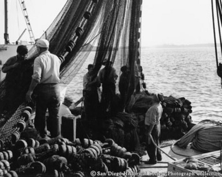 Fishermen tending to nets on San Diego waterfront