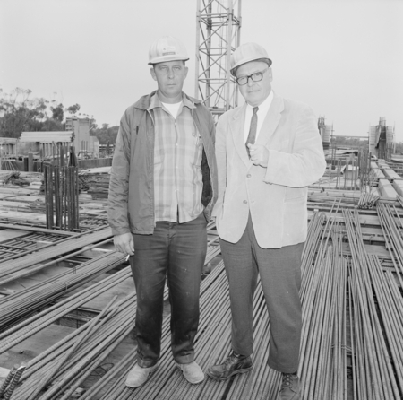 Jim Gibson (left) and unidentified man at construction site of Geisel Library, UC San Diego