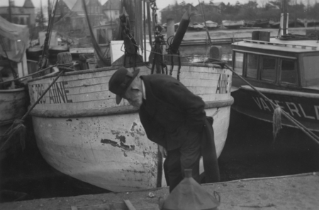 Georg Duncker inspecting a fish boat in the fishing harbor at Niendorf on den Ostsee