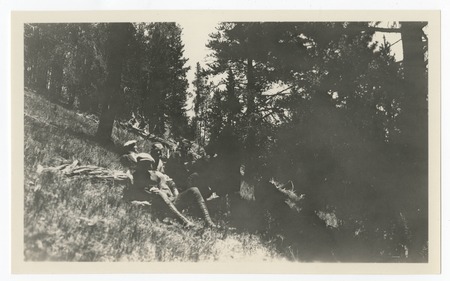 Group resting on slope, Yellowstone National Park
