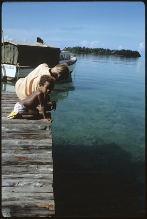 Anne Scheffler and child on a pier