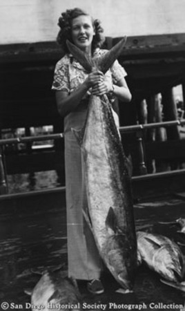 Ruth Edgar posing with yellowtail tuna catch