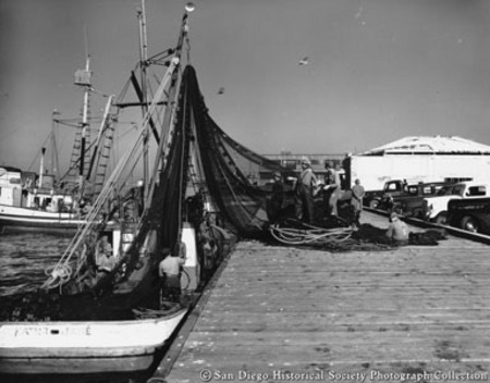 Loading nets on to fishing boat Kathy Jane