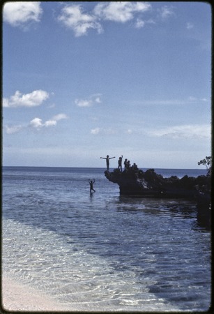 Children jump from rocks into lagoon near Kaibola village