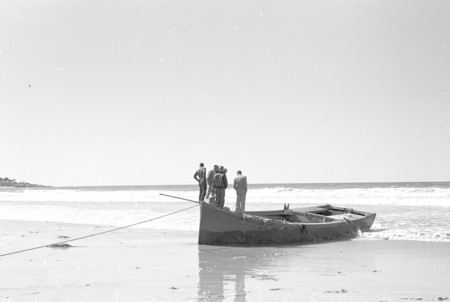 Scripp buoy tender boat washed ashore in a storm. Boat dragged anchors from anchorage off Scripps Pier, circa 1948