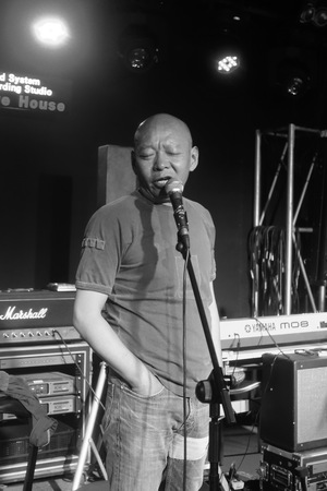 Yue Minjun singing the blues in a music studio in Songzhuang art colony 10 of 11