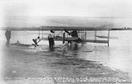 Glen Curtiss starting in his hydroplane on first successful flight ever made from the water [on San Diego Bay] ...