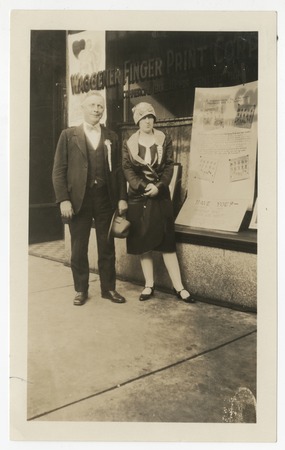 Man and woman in front of Waggener Finger Print Corporation office, San Diego