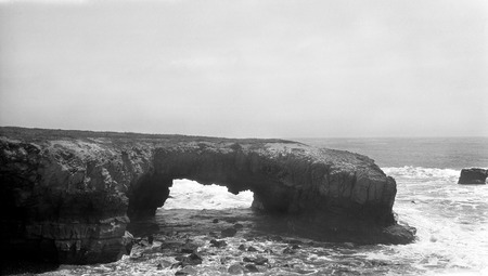 An arch, from which the sandstone has worn from underneath