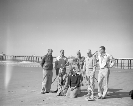 Francis Shepard and geology class design a suspended sediment trap for the  study of sand transport onto the beach. Nets were made from the toes of  wives' nylon stockings. L-r: Donald Sayner