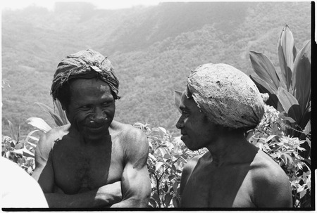 Kinimbong men with barkcloth caps