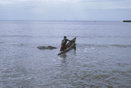 Native launches dugout [canoe Freetown, Sierra Leone]