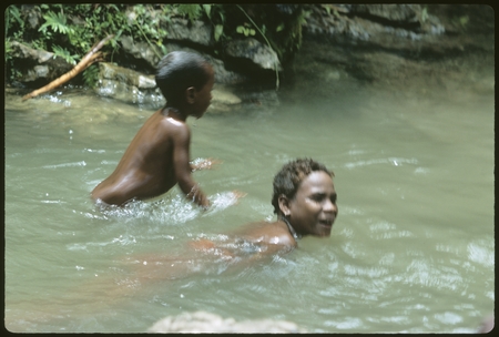 Girls swimming in the creek running by Uka&#39;oi.