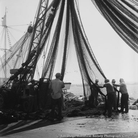 Crane hoisting fishing net on Embarcadero