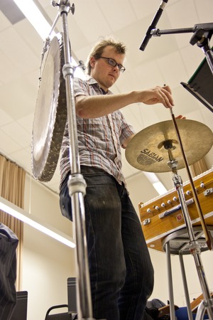 Ping: Rehearsal for 2011 UC San Diego performance: Ross Karre bowing cymbal, as described in period image.
