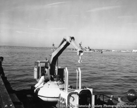 Hoisting machinery and French bathyscaphe on boat docked on San Diego waterfront