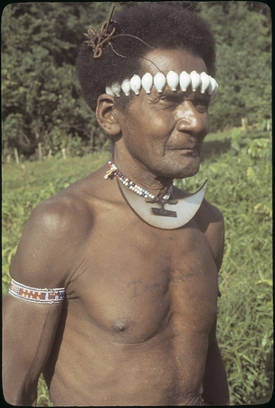 Man with dafi on neck and tale&#39;ekalango on forehead.