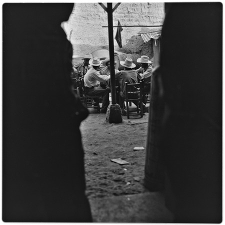 Men at a table in Batuc