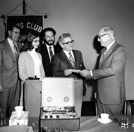 Robert Jackson (center) of the Pacific Beach Lion&#39;s Club presenting donation to Chancellor William D. McElroy