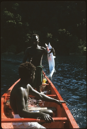 Man showing fish